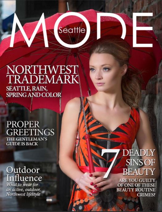 Image: MODE April issue cover. Female model holding an umbrella.